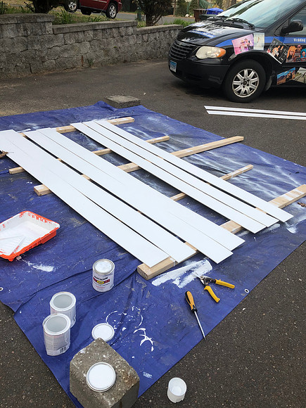 Day 37 Painting the Ship lap that will go one the walls April 26, 2020